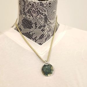 Artisian handmade glass necklace piece with leather band and sliver clasp.